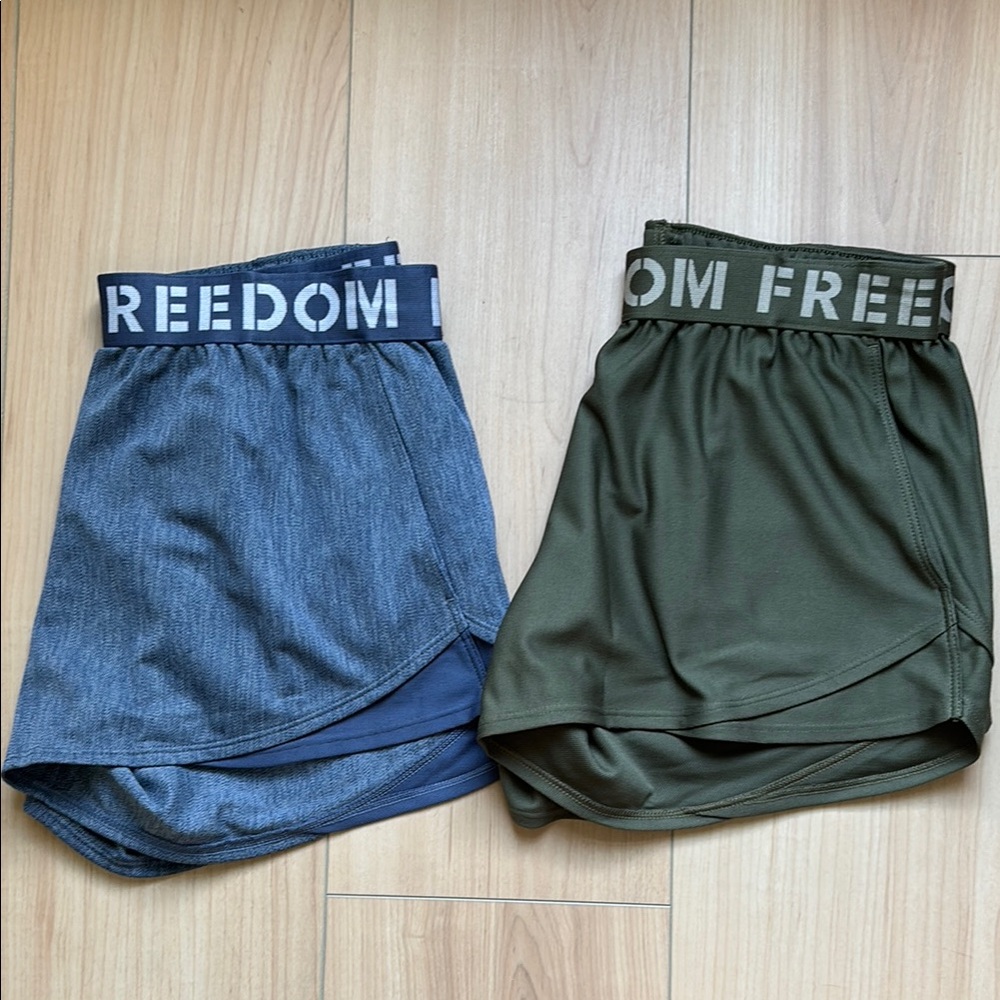 Bundle of 2 Under Armour Freedom Play Up Shorts. Blue and Green. Size Small.